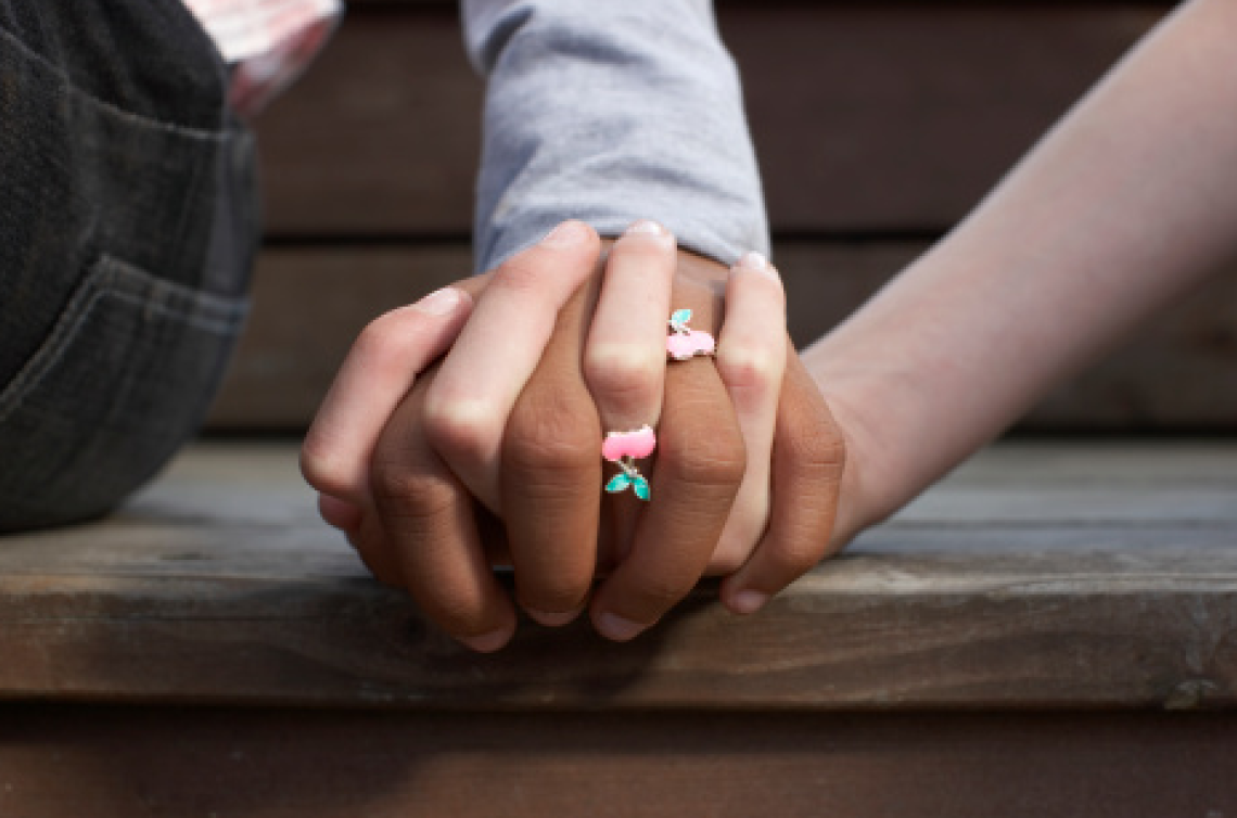 Couple holding hands