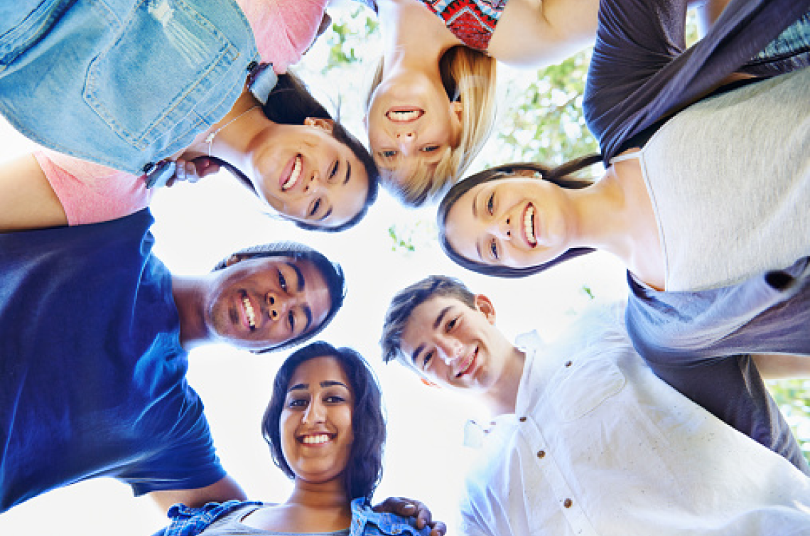 Teens looking down at the camera