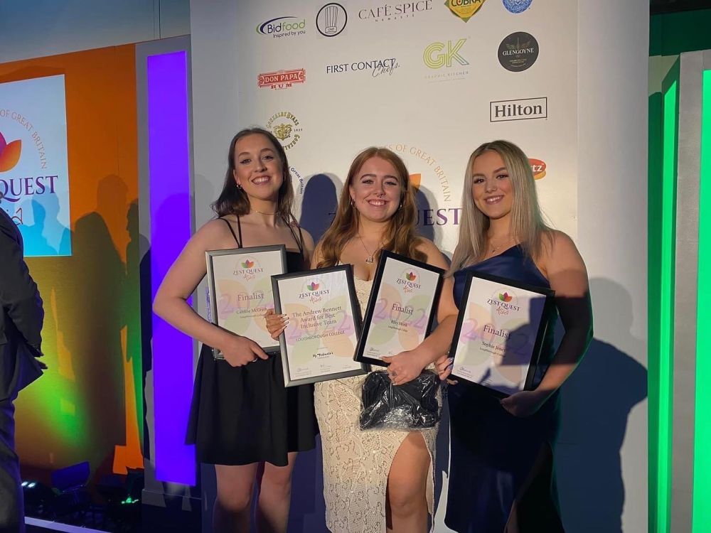 Award winners Sophie Jones, Caitlin McGrath and Riley Monk stood at the awards ceremony holding framed award certificates
