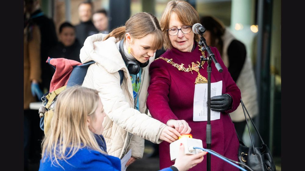 Mayor Smidowicz and learner Abigail switch on the lights