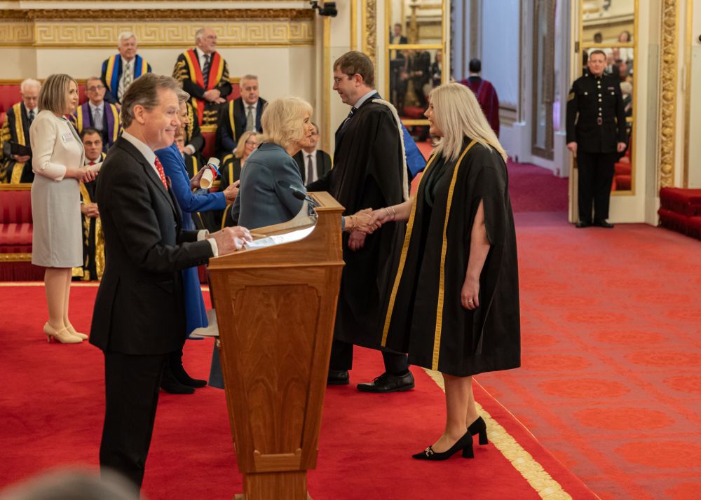 Principal and CEO Heather Clarke accepts the Queen's Anniversary Prize from Her Majesty, Queen Camilla