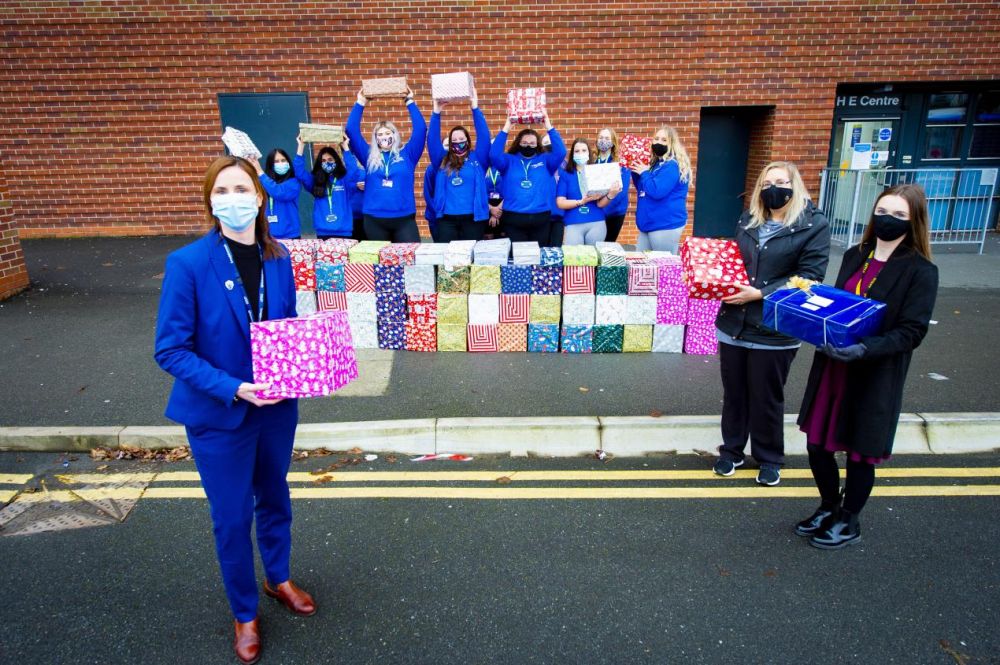 Students and Staff cheering outside of the main college building