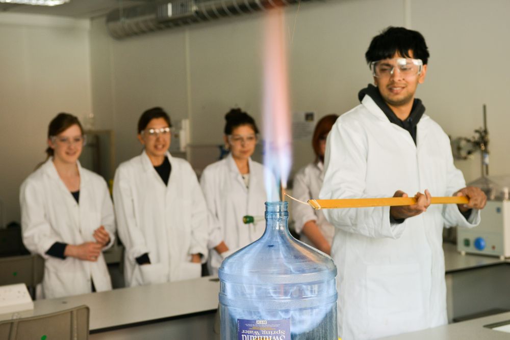 Young man doing science experiment